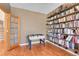 Cozy den featuring a foosball table and floor-to-ceiling bookshelves at 3644 Sunchase Dr, Castle Rock, CO 80109