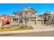 Charming two-story home with a brick facade and well-maintained landscaping with attached two car garage at 3644 Sunchase Dr, Castle Rock, CO 80109