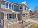 Charming two-story home featuring a welcoming front porch, brick accents, and a well-manicured lawn is move-in ready at 3644 Sunchase Dr, Castle Rock, CO 80109