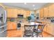 Bright kitchen featuring light wood cabinets, granite countertops, and stainless steel appliances at 3644 Sunchase Dr, Castle Rock, CO 80109