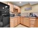 Kitchenette area equipped with modern appliances, ample cabinet space, and a wine rack at 3644 Sunchase Dr, Castle Rock, CO 80109