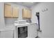 Laundry room with modern washer, dryer and storage cabinets at 3644 Sunchase Dr, Castle Rock, CO 80109