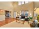 Inviting living room with hardwood floors, comfortable seating, and bright natural light at 3644 Sunchase Dr, Castle Rock, CO 80109