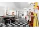 Basement area with a retro soda fountain, diner-style seating, vintage decor, and black and white checkered floors at 11745 Newton St, Westminster, CO 80031