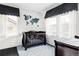 Charming Bedroom with a dark wood crib, blue accents, white shiplap walls, and a world map design at 11745 Newton St, Westminster, CO 80031