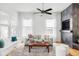 Inviting living room with hardwood floors, a slate accent wall and a comfortable seating area at 11745 Newton St, Westminster, CO 80031