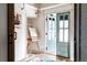 Inviting studio space with an easel, natural light, white shiplap walls, and a colorful accent rug at 11745 Newton St, Westminster, CO 80031