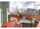 Wooden deck with outdoor dining and barbecue area, perfect for gatherings at 19634 E Clear Creek Trl, Parker, CO 80134