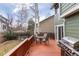 Outdoor living area with a well-maintained wooden deck, complete with a grill and dining set at 19634 E Clear Creek Trl, Parker, CO 80134