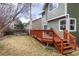 A backyard featuring a wooden deck that extends from the house offering space for outdoor dining and relaxation at 19634 E Clear Creek Trl, Parker, CO 80134