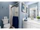 Updated bathroom featuring a glass shower door, modern fixtures, and blue walls at 19634 E Clear Creek Trl, Parker, CO 80134