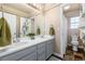 Bright bathroom featuring a double sink vanity and a separate toilet/shower room at 19634 E Clear Creek Trl, Parker, CO 80134