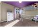 Bedroom with high rise bed, neutral carpeting, and natural light at 19634 E Clear Creek Trl, Parker, CO 80134