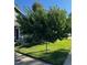 A manicured front yard featuring lush green lawn, mature tree, and well-maintained landscaping enhancing curb appeal at 19634 E Clear Creek Trl, Parker, CO 80134