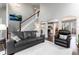 Bright living room with a soaring ceiling, hardwood floors, and an open floorplan that flows into the kitchen at 19634 E Clear Creek Trl, Parker, CO 80134