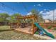Backyard deck with a bar, string lights, and a slide for the to play on at 15685 E 50Th Ave, Denver, CO 80239