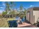 Charming brick patio with outdoor seating, perfect for enjoying the peaceful backyard setting at 15685 E 50Th Ave, Denver, CO 80239