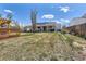 Wide backyard with a wood deck and a covered patio at 15685 E 50Th Ave, Denver, CO 80239