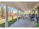 Relaxing covered patio with plenty of space for seating and enjoying the outdoors at 15685 E 50Th Ave, Denver, CO 80239