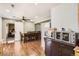Open-concept dining area with wood flooring and easy access to the kitchen and other living spaces at 15685 E 50Th Ave, Denver, CO 80239