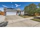 Charming single-story home with a well-maintained yard, covered porch, and a two-car garage at 15685 E 50Th Ave, Denver, CO 80239