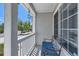 Relaxing front porch with a cozy seating area and views of the neighborhood street at 15685 E 50Th Ave, Denver, CO 80239