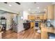 Functional kitchen with stainless steel appliances, wood cabinets, and wood flooring at 15685 E 50Th Ave, Denver, CO 80239