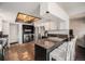 Kitchen with granite countertops, stainless steel appliances, and an adjacent laundry area at 1572 W Long Ave, Littleton, CO 80120