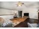 Spacious living room with a modern media console and a partial view of the dining area at 1572 W Long Ave, Littleton, CO 80120