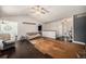 Open living room with vaulted ceilings and a partial view of the front entry at 1572 W Long Ave, Littleton, CO 80120