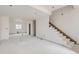 Basement area with staircase, unfinished floors, and white walls, ready for customization at 226 Ash St, Bennett, CO 80102