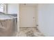 Unfinished bathroom features white walls, ready for your customization with an adjacent covered bath tub at 226 Ash St, Bennett, CO 80102
