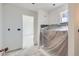Under construction bathroom, offering a blank canvas for customization, featuring a bright window at 226 Ash St, Bennett, CO 80102