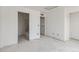 Inviting living area showcasing open doorways and versatile space for your design preferences at 226 Ash St, Bennett, CO 80102