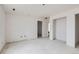 Open-concept living room awaiting customization, showing bare studs, multiple doorways, and recessed lighting at 226 Ash St, Bennett, CO 80102