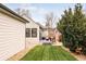 Inviting backyard featuring a covered patio, lush lawn, and tasteful landscaping, perfect for outdoor enjoyment at 2939 Osceola St, Denver, CO 80212