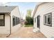 A gravel path leads to a secluded backyard with well-maintained landscaping, showcasing a charming outdoor space at 2939 Osceola St, Denver, CO 80212