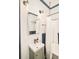 Charming bathroom features blue tiling, vanity, mirror, and decorative lighting fixtures at 2939 Osceola St, Denver, CO 80212