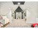 Unique bonus room with built-in shelves and architectural interest for playroom or flex space at 2939 Osceola St, Denver, CO 80212