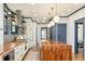 Modern kitchen with butcher block island, stainless steel appliances, and stylish pendant lighting at 2939 Osceola St, Denver, CO 80212