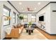 Bright living room with many windows, hardwood floors, and modern finishes at 2939 Osceola St, Denver, CO 80212