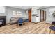 Cozy dining area with modern chairs, a fireplace, and wood-look flooring at 2063 Montane E Dr, Golden, CO 80401