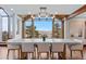 Dining room showcasing a modern table setting and large windows with panoramic mountain vistas at 2063 Montane E Dr, Golden, CO 80401