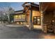 Inviting home exterior with stone accents, a covered entry, and an asphalt driveway at 2063 Montane E Dr, Golden, CO 80401