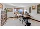 Bright home office with large desk and mountain views from wood trimmed windows at 2063 Montane E Dr, Golden, CO 80401