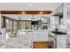 Bright, open kitchen featuring marble countertops, stainless steel appliances, and a spacious island at 2063 Montane E Dr, Golden, CO 80401