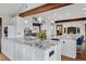 Modern kitchen with granite countertops, white cabinets, stainless steel appliances, and a center island at 2063 Montane E Dr, Golden, CO 80401