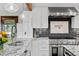 Gourmet kitchen with marble counters, stainless steel appliances, and modern fixtures at 2063 Montane E Dr, Golden, CO 80401