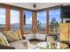 Bright, open living room features comfortable seating and amazing mountain views at 2063 Montane E Dr, Golden, CO 80401