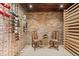 Beautiful wine cellar with brick wall, individual wine racks and space for sitting at 2063 Montane E Dr, Golden, CO 80401